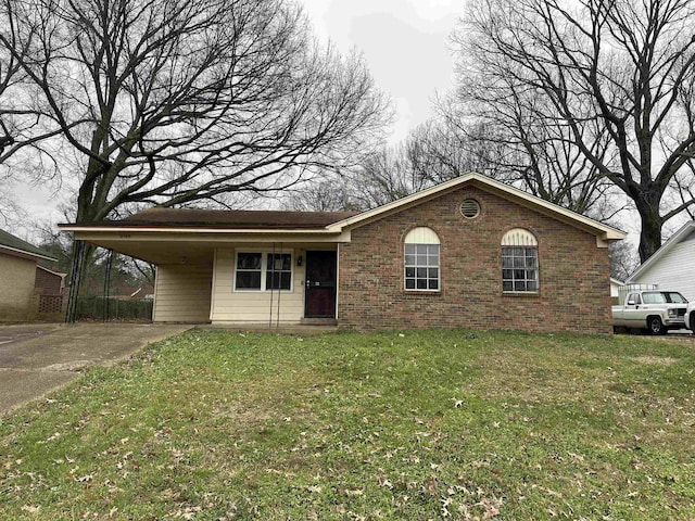 single story home with brick siding, an attached carport, concrete driveway, and a front lawn