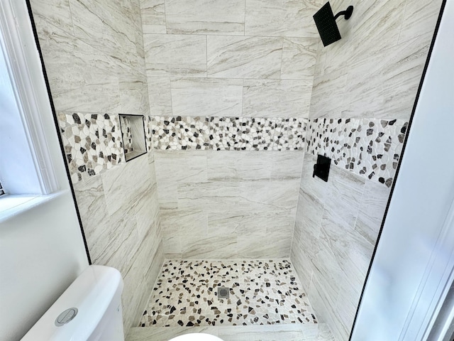 full bath with tiled shower