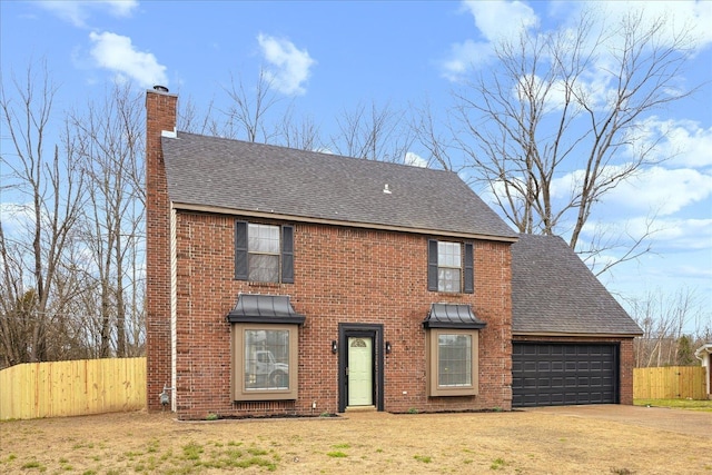 view of front of property with fence, roof with shingles, a chimney, a garage, and driveway