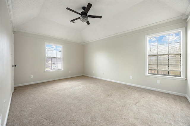 empty room with baseboards, a ceiling fan, lofted ceiling, and carpet