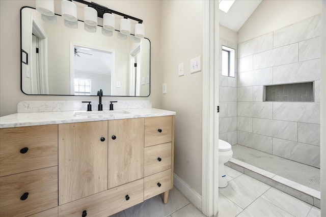 full bathroom with lofted ceiling, toilet, vanity, and plenty of natural light