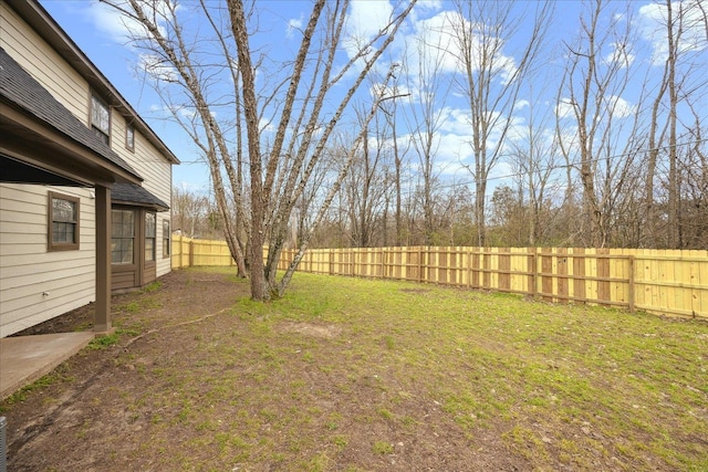 view of yard with a fenced backyard