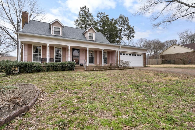 cape cod house with driveway, fence, covered porch, a front yard, and a garage