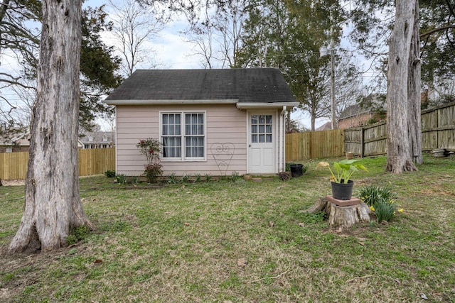 view of outbuilding featuring a fenced backyard