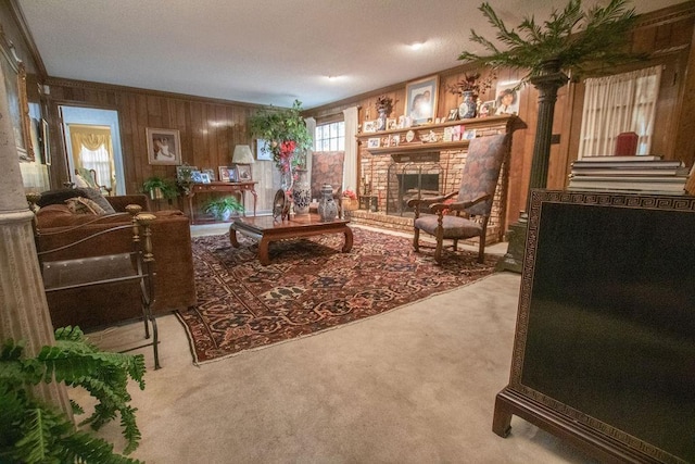 carpeted living area with wooden walls, a brick fireplace, and ornamental molding