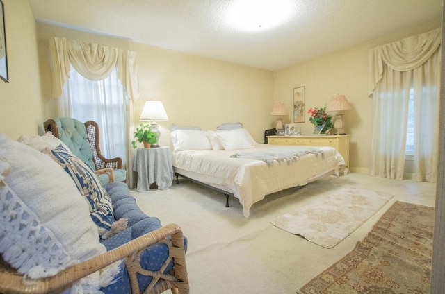 carpeted bedroom with a textured ceiling