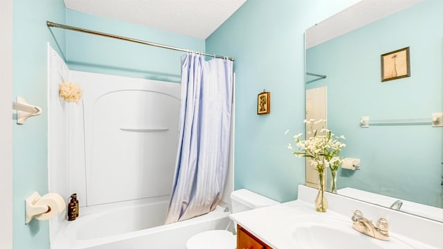 full bath with vanity, toilet, shower / bath combo, and a textured ceiling