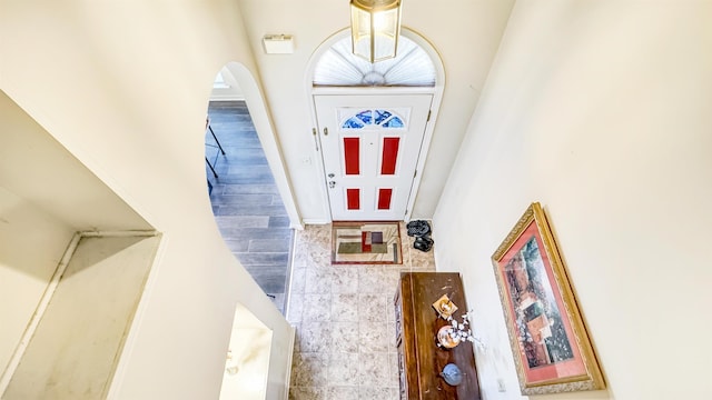 entrance foyer featuring arched walkways