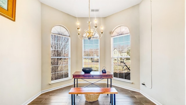 office with visible vents, baseboards, a notable chandelier, and dark wood-style floors