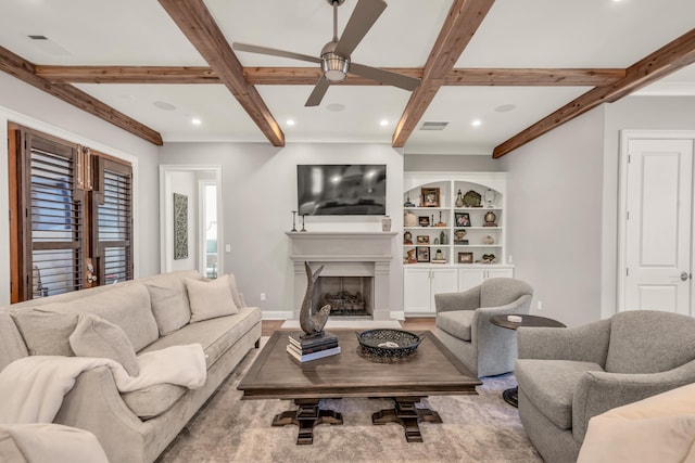 living room with beamed ceiling, visible vents, recessed lighting, a fireplace, and baseboards