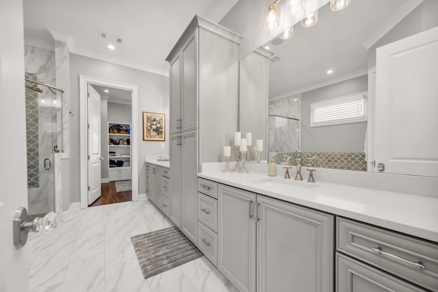 bathroom featuring visible vents, marble finish floor, a shower stall, and crown molding