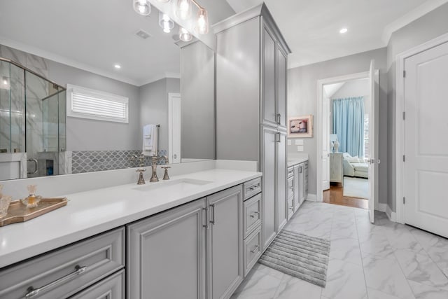 ensuite bathroom featuring crown molding, visible vents, marble finish floor, and a stall shower