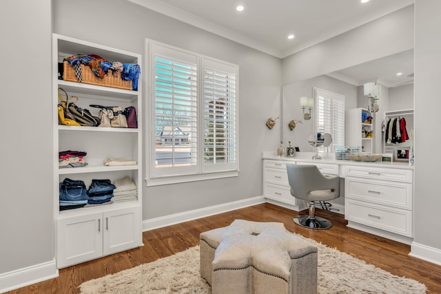 office area featuring baseboards, plenty of natural light, dark wood finished floors, and crown molding