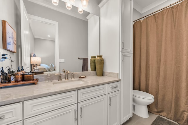 ensuite bathroom with connected bathroom, crown molding, toilet, tile patterned floors, and vanity