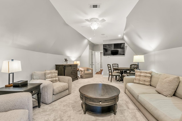 carpeted living room with visible vents, a ceiling fan, and vaulted ceiling