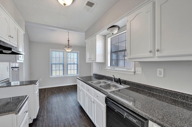 kitchen with visible vents, dishwasher, white cabinetry, and a sink