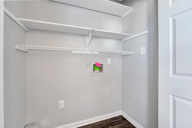 clothes washing area with baseboards, washer hookup, laundry area, dark wood-style floors, and hookup for an electric dryer