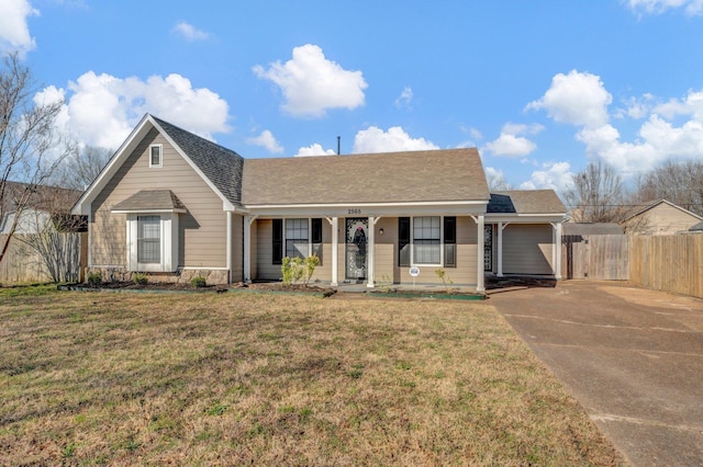 single story home featuring a shingled roof, concrete driveway, a front lawn, and fence