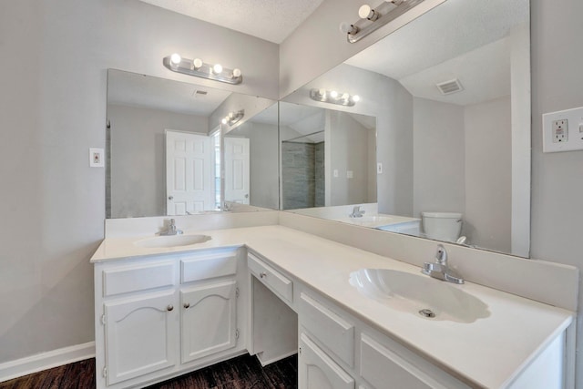 full bath featuring a sink, visible vents, and double vanity