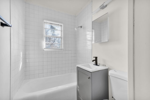 full bathroom featuring toilet, vanity, and bathtub / shower combination