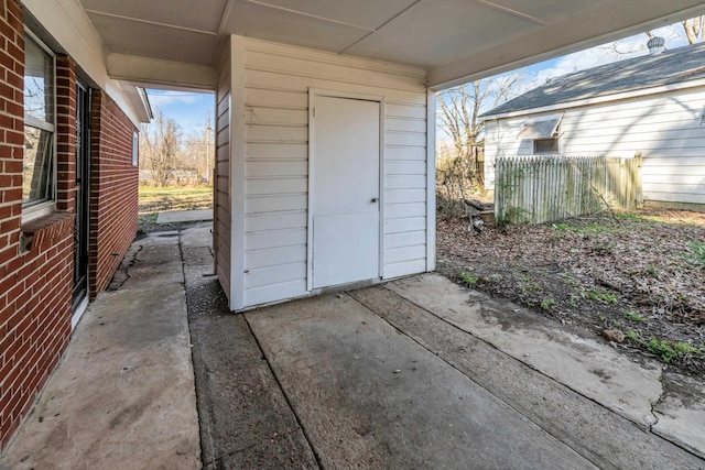 view of outdoor structure with fence