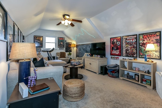 carpeted living room featuring ceiling fan and vaulted ceiling