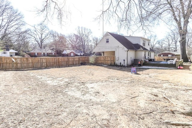 view of home's exterior featuring a residential view, central AC, and fence