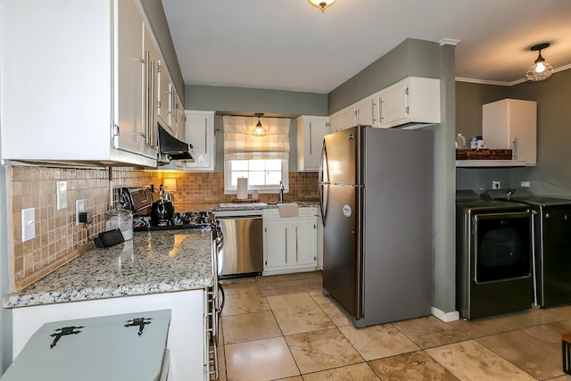 kitchen with washer and clothes dryer, white cabinets, appliances with stainless steel finishes, and backsplash