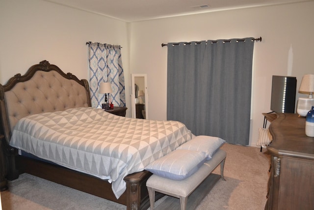 carpeted bedroom with visible vents