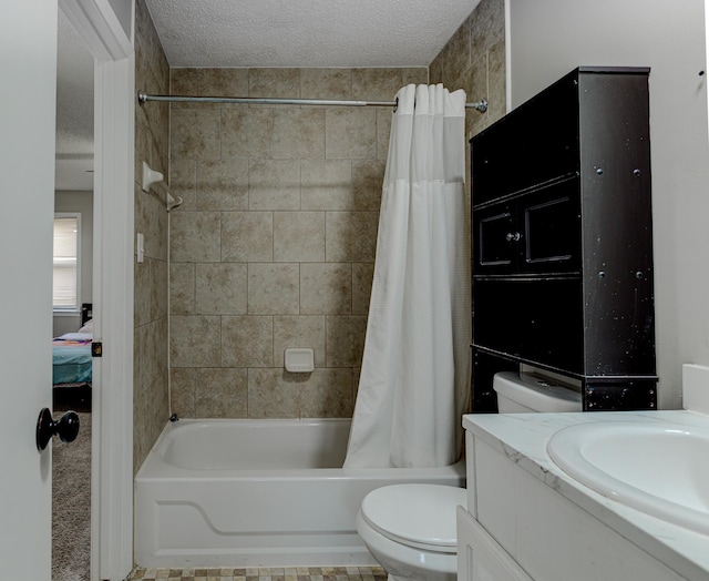 full bath with vanity, shower / bath combo with shower curtain, ensuite bathroom, a textured ceiling, and toilet