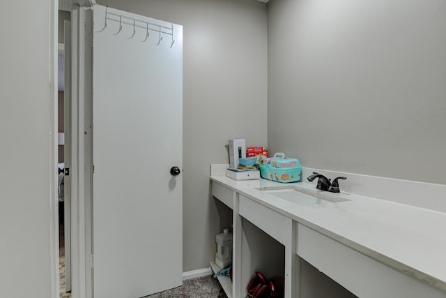 bathroom featuring vanity and baseboards