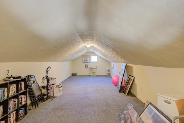 bonus room with baseboards, lofted ceiling, and carpet floors