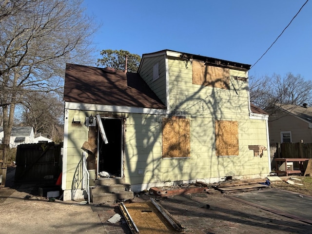 view of side of home with fence