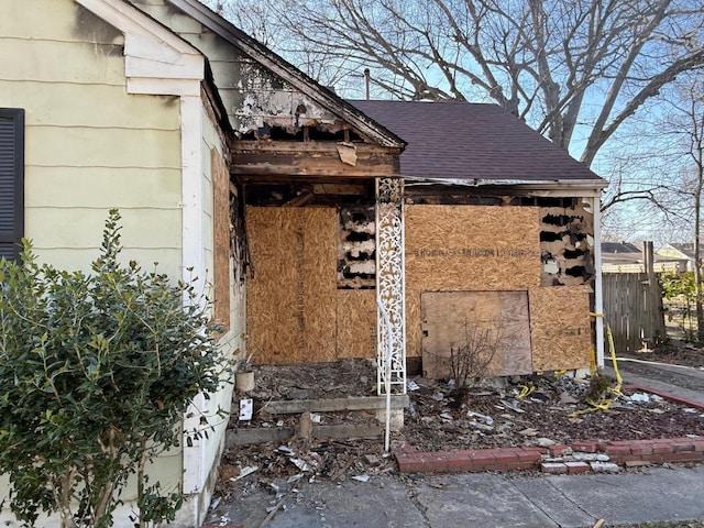 exterior space with a shingled roof