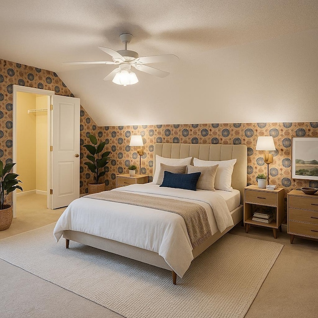 8955 Buckstone Cv, Memphis, TN 38018 - bedroom featuring vaulted ceiling, wallpapered walls, light colored carpet, and a ceiling fan