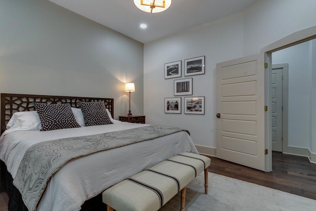 bedroom featuring recessed lighting, baseboards, and wood finished floors