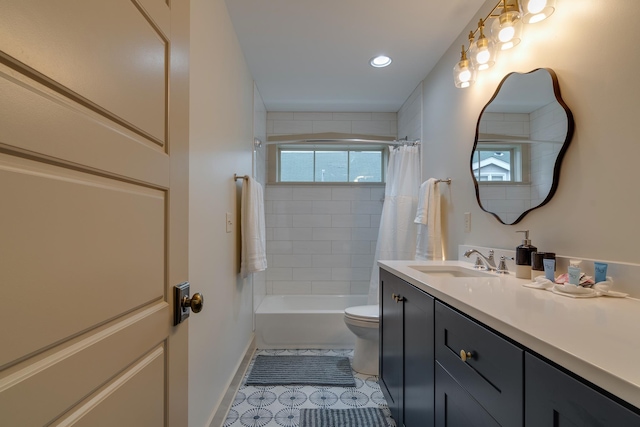 full bath featuring vanity, baseboards, shower / bath combo with shower curtain, tile patterned floors, and toilet