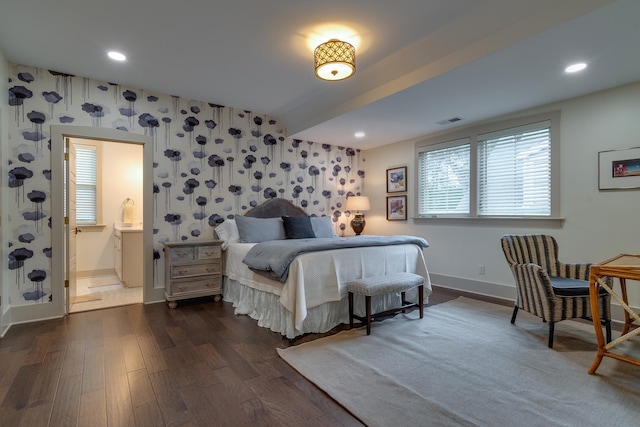 bedroom with visible vents, wallpapered walls, baseboards, dark wood finished floors, and recessed lighting