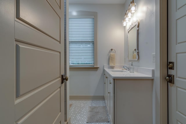 bathroom with vanity and baseboards