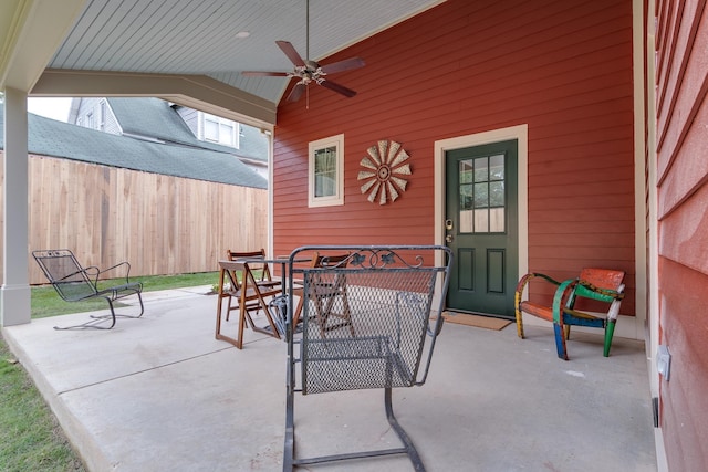 view of patio / terrace featuring outdoor dining space, a ceiling fan, and fence