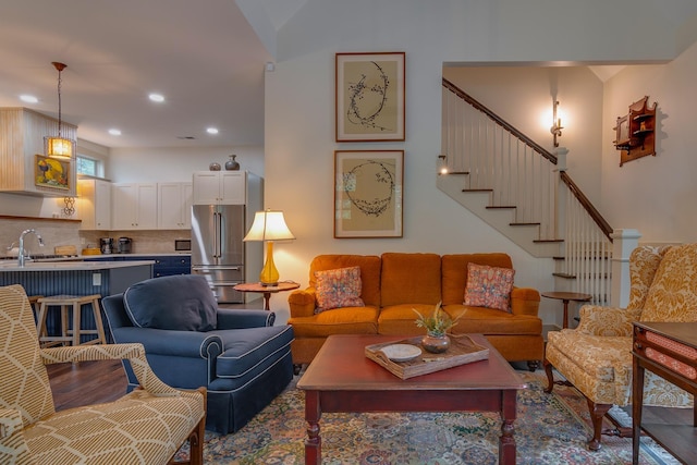 living room featuring stairway and recessed lighting