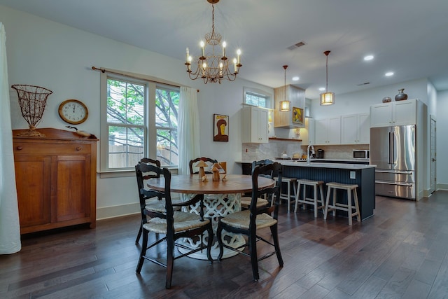 dining space with dark wood-type flooring, recessed lighting, baseboards, and visible vents