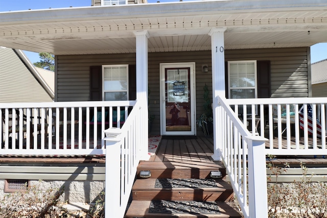 property entrance featuring covered porch