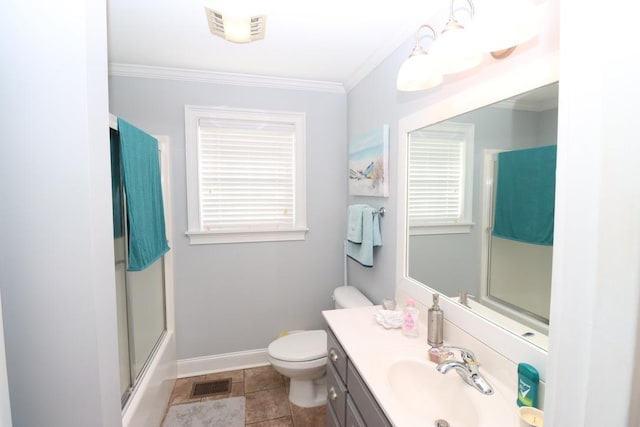 full bathroom featuring visible vents, toilet, a shower with door, crown molding, and vanity