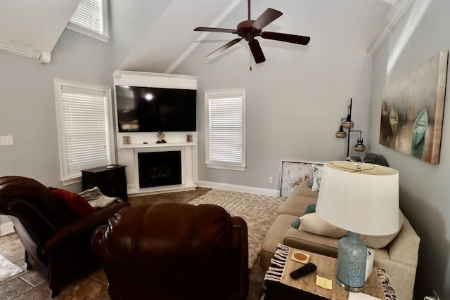 living room with a ceiling fan, a fireplace, baseboards, and high vaulted ceiling