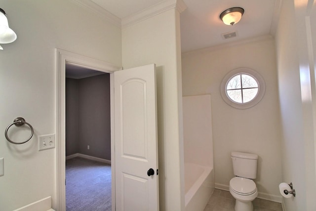 bathroom featuring visible vents, baseboards, and ornamental molding