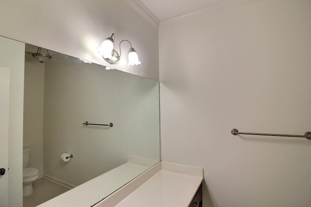 bathroom featuring vanity, tile patterned floors, toilet, and ornamental molding