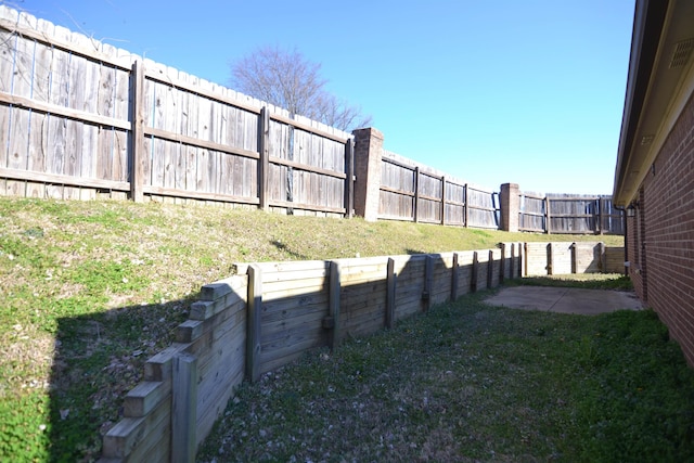 view of yard with a fenced backyard