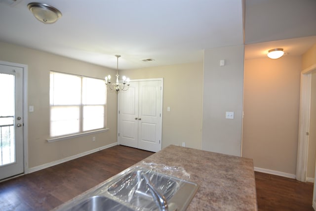 dining area with visible vents, baseboards, and dark wood-type flooring