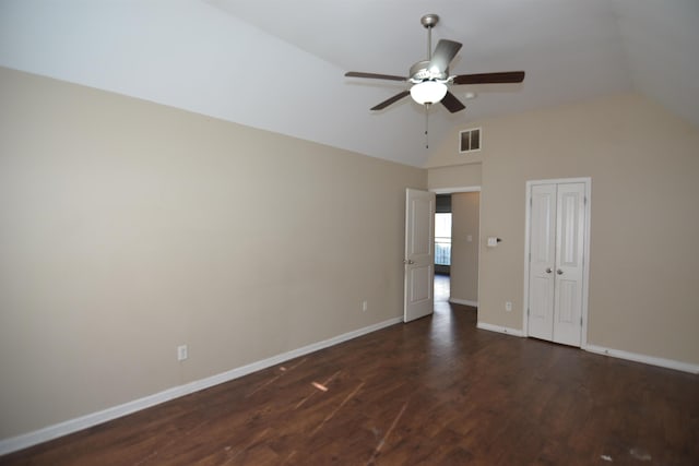 unfurnished room featuring visible vents, ceiling fan, baseboards, vaulted ceiling, and wood finished floors